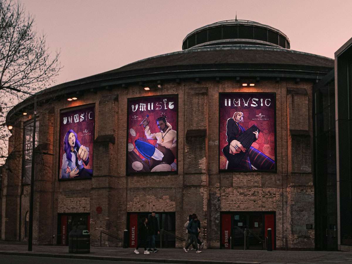 A mockup of the exterior of The London Roundhouse showing three poster designs lit at dusk. The poster show office workers using various office equipment as musical instruments, with an illustrated gradient background.