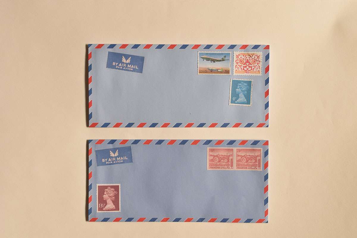 Handmade blue airmail envelope, containing translation of tape