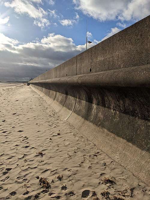 Personal photo of curved sea wall along Bridlington's South beach. 