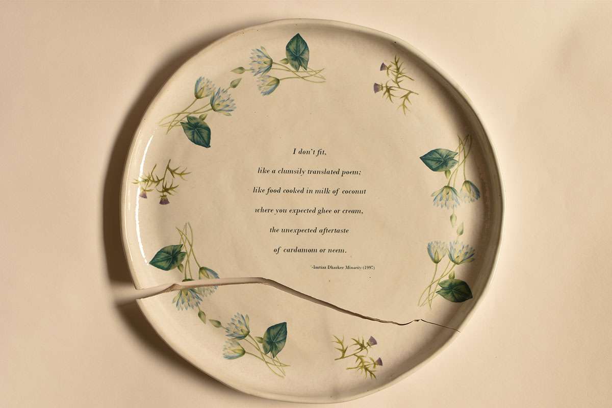 Ceramic plate with ceramic transfer text and floral décor. 